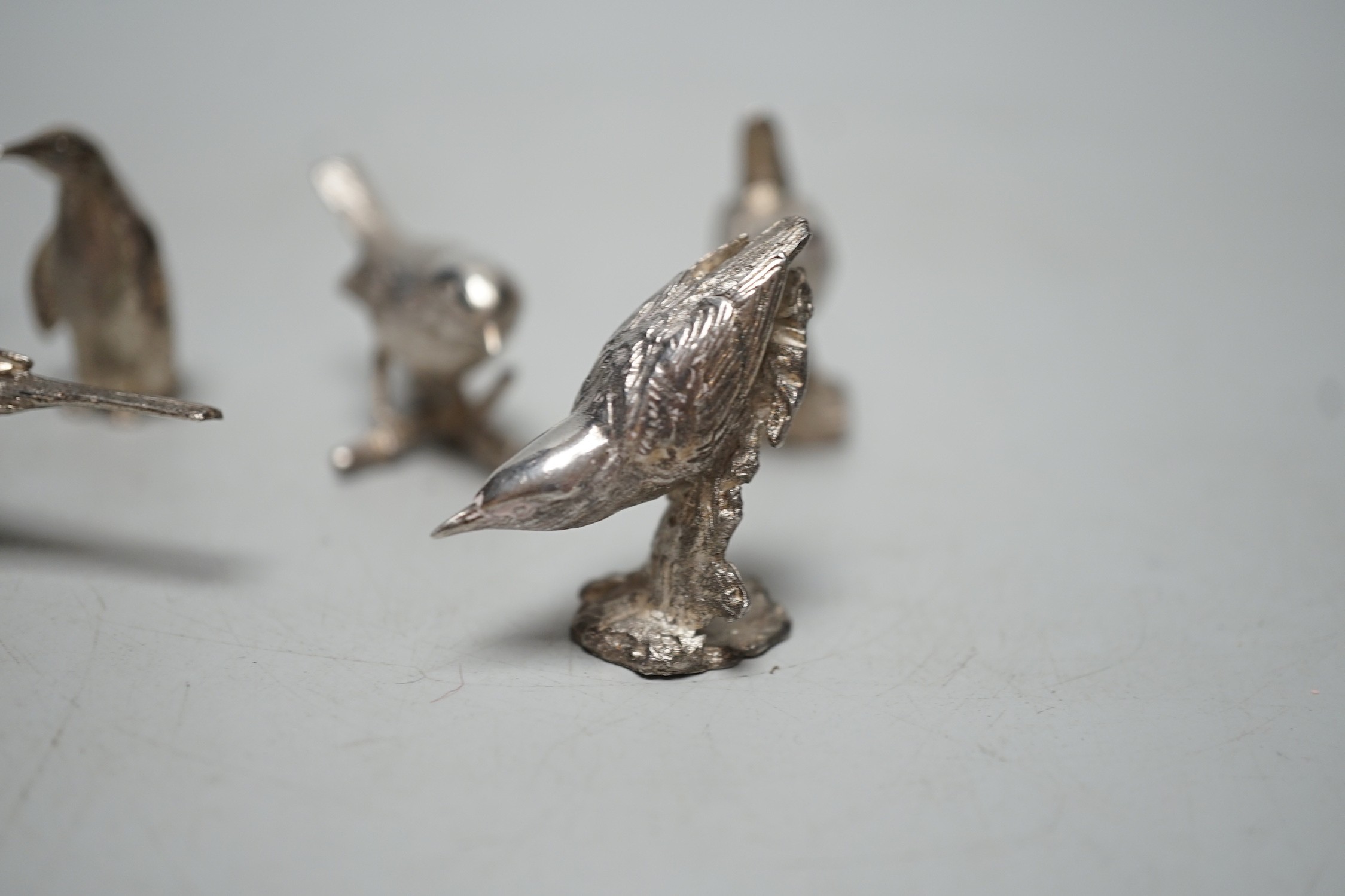 A small collection of seven 1980's/1990's miniature silver models, by Paul Eaton, comprising five birds, a rabbit and a penguin, tallest 43mm.